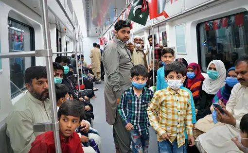 Lahoris riding the Orange Line for the first time. The railway will improve the lives of many in the city. Image by Sabrina Toppa. Pakistan, 2020.