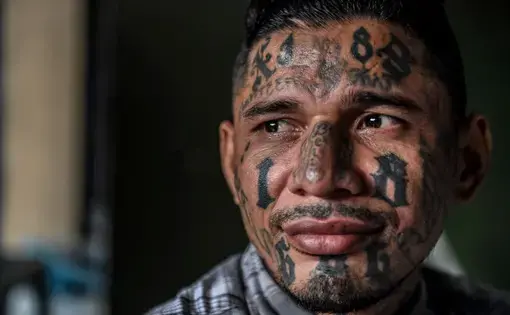 A born-again member of the 18th Street gang now living in the Eben Ezer evangelical church. Image by Neil Brandvold. El Salvador, 2018.