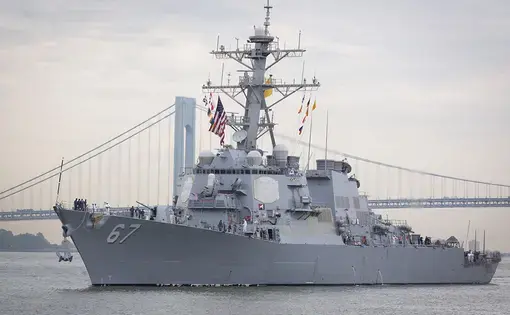 Guided-missile destroyer USS Cole (DDG 067) approaching Sullivan's Piers with the Verrazzano-Narrows Bridge in the background. The ship is part of Fleet Week NY. Image by Glynnis Jones / Shutterstock.com. United States, 2014.