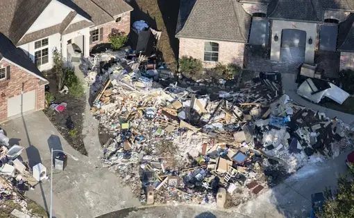 Hurricane Harvey is expected to be the costliest natural disaster in U.S. history. Thousands of homes were flooded, many requiring major repairs. Here debris piles await removal from gutting two homes in Northwest Forest, a subdivisions of Beaumont. Image by Dan Grossman. United States, 2017. 