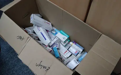 Medicine is collected in boxes at the offices of the National Organization of Transplants of Venezuela (ONTV) to be donated to dialysis and transplant patients. Image by Flaviana Sandoval. Venezuela, 2018. 