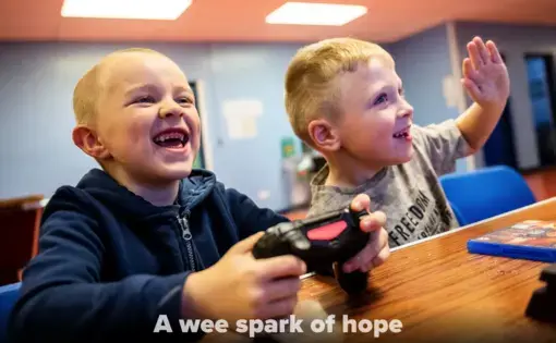Kyle Hamilton, 7, left, and Lucas Barpon, 7, both of Possilpark, play a wrestling video game on a Playstation during a Young People's Futures session, Oct. 25, 2019, at Possilpoint Community Centre in Possilpark, Glasgow, Scotland. Image by Michael Santiago. United Kingdom, 2019.