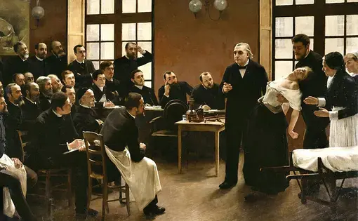 A Clinical Lesson at the Salpêtrière by Pierre Aristide André Brouillet (1857-1914) featuring Dr Charcot. Image courtesy Wiki Commons.