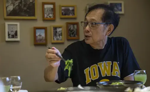 Michael Lee, owner of the Hamburg Inn in Iowa City, eats lunch during a visit to Taizhou, China, on Friday, Sept. 29, 2017. Lee plans to expand his business to China, encompassing both food and education, with headquarters in Taizhou, north of Shanghai. Image by Kelsey Kremer. China, 2017.