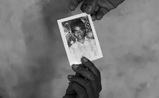 Jeyarani Vaiththeeswaran and her daughter hold a photograph of their missing son and brother Antany. Image by Moises Saman for Magnum Photos. Sri Lanka, 2018.