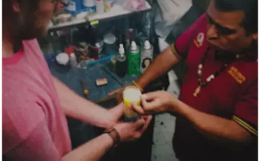 Erik Vance participates in a blessing with a Mexican brujo, or witch doctor, in which he has a self-inflicted curse lifted from him