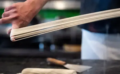 Tony Mao makes hand-pulled noodles at Everyday Noodles. Image by Stephanie Chambers. United States, 2018. Tony Mao makes hand-pulled noodles at Everyday Noodles. Image by Stephanie Chambers. United States, 2018.