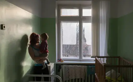 Elena and her son are staying at a hospital before handing the child to an orphanage. Image by Anastasia Rudenko. Russia, 2017.
