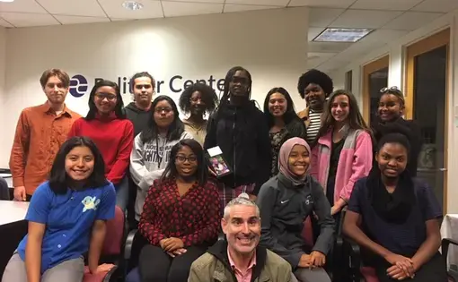 Finalists of the 2018 DCPS Study Abroad Photography Contest pose for a picture with photojournalist Louie Palu. Image by Fareed Mostoufi. United States, 2018.