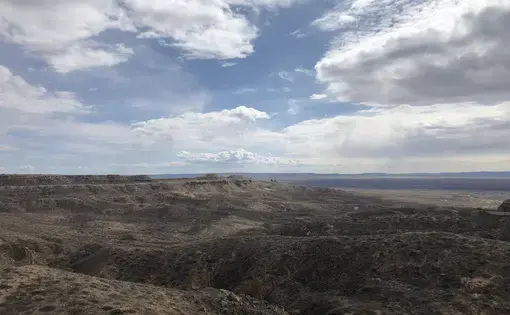 Delivering a vaccine to members of the Hopi Nation entails challenging transportation logistics—Hopi tribal lands, which sit on more than 1.5 million acres in northeastern Arizona, are remote and do not use formal street addresses. Image by Duane Humeyestewa. United States, 2020.