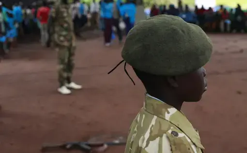 A former child soldier is standing in formation at a child soldiers release ceremony in Yambio, South Sudan.  Image by Andreea Campeanu. South Sudan, 2018.