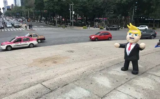 A Donald Trump piñata in the center of Mexico City. Many Mexicans are deeply fearful of Trump's enacting his campaign promises to cancel or alter NAFTA, restrict remittances sent to Mexico from the United States, deport millions of undocumented immigrants living in the U.S., and build a wall along the U.S.-Mexico border. Image by Nick Schifrin. Mexico, 2016.