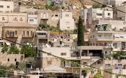 Murals of eyes look out from across the Wadi Hileh area in the Palestinian neighbourhood in Silwan. Image by BBC News Arabic.