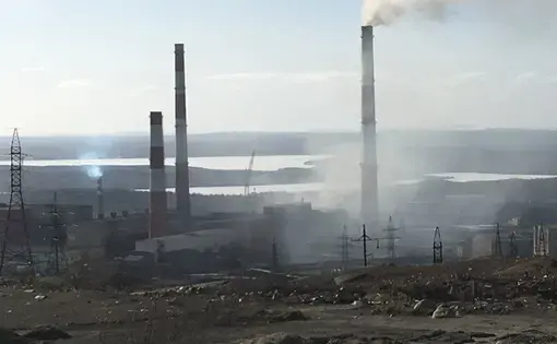 The smelting plant in Nikel is so old, the pollution billows out of the plant itself, in addition to the smokestack. Image by Amy Martin. Russia, 2018.