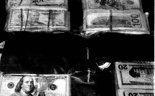 Money seized from a St. Matthews, KY hotel in February 2018 through asset forfeiture. Image courtesy of Jefferson County Circuit Court. United States, 2018.