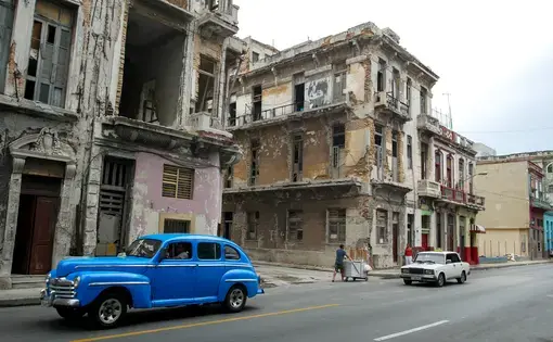 Buildings a block from Havana’s famed Malecón, a seaside walkway stretching more than four miles, show the ravages of time and weather. Image by Tracey Eaton. Cuba, 2018.