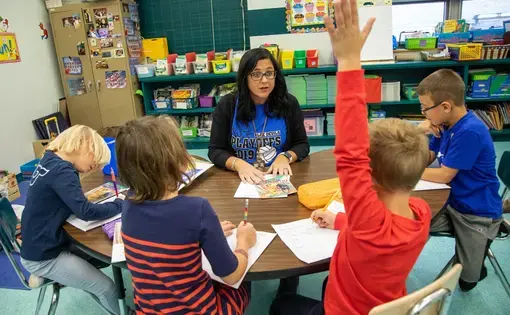 First-grade teacher Niva Vargo works with her students on a reading activity at David Leech Elementary in Leechburg. Image by Andrew Rush. United States, 2019.