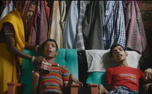 Vikas Yadav, 19, and Aman Yadav, 17, brothers, have muscular dystrophy and are being cared for by their mother at their home. Affected by toxic waste which seeped into the groundwater, they will live short, painful lives. Image by Rohit Jain. India, 2018. Image by Rohit Jain. India, 2019.