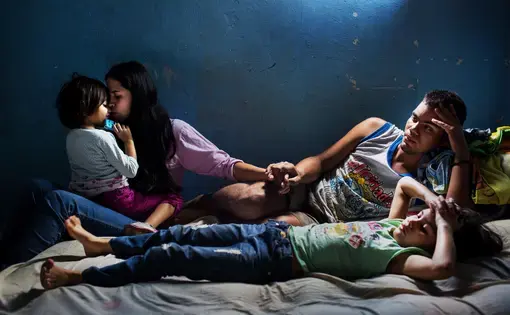 Richard and Elixa and their two daughters. Image by Natalie Keyssar. Venezuela, 2016.
