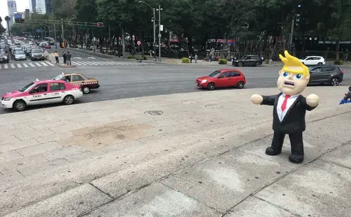 A Donald Trump piñata in the center of Mexico City. Many Mexicans are deeply fearful of Trump's enacting his campaign promises to cancel or alter NAFTA, restrict remittances sent to Mexico from the United States, deport millions of undocumented immigrants living in the U.S., and build a wall along the U.S.-Mexico border. Image by Nick Schifrin. Mexico, 2016.