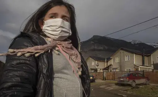 Natalie Galindo, 10, has severe asthma and most trips outside her home in the town of Coyhaique involve wearing a mask — or even a respirator. Image by Larry C. Price. Chile, 2018.