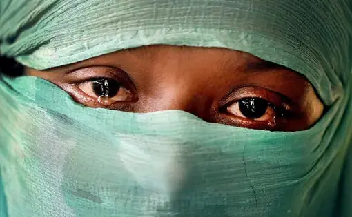 In this Wednesday, Nov. 22, 2017, photo, F, 22, who says she was raped by members of Myanmar’s armed forces in June and again in September, cries as she speaks to The Associated Press in her tent in Kutupalong refugee camp in Bangladesh. The Associated Press has found that the rape of Rohingya women by Myanmar’s security forces has been sweeping and methodical. The AP interviewed 29 women and girls who say they were raped by Myanmar’s armed forces, and found distinct patterns in their accounts, their…