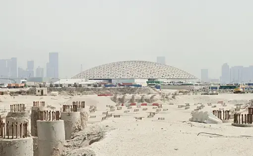 The Louvre Abu Dhabi dome and the site of the Guggenheim’s troubled project. Image by Knut Egil Wang. UAE, 2016.