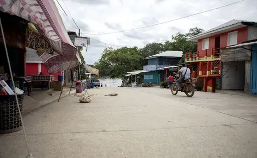 The main street in La Técnica, Guatemala, leads to a boat ramp on the Usumacinta River, which forms the international border with Mexico. Image by Miguel Gutierrez Jr. Guatemala, 2019.