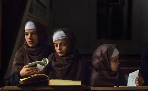Albanian children studying the Koran. Image by Monika Bulaj. Kosovo, 2013.