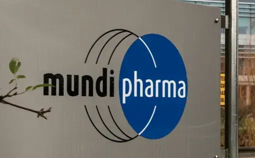 This Dec. 12, 2019, photo shows a sign at the Mundipharma International headquarters at Cambridge Science Park in England. Mundipharma is the international affiliate of Purdue Pharma, the maker of the blockbuster painkiller OxyContin. Mundipharma is now marketing Nyxoid, a new brand of naloxone, an opioid overdose reversal medication. Image by Leila Coker / AP Photo. United Kingdom, 2019.