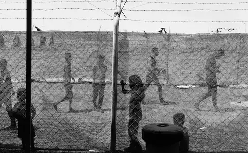 Thousands of men and boys have been convicted of ISIS affiliation, and hundreds have been hanged. But these cases make up only a small fraction of the detainees. Thousands of families have been sent to camps in the desert, cast out from society. Moises Saman / Magnum for The New Yorker. Iraq, 2018. Thousands of men and boys have been convicted of ISIS affiliation, and hundreds have been hanged. But these cases make up only a small fraction of the detainees. Thousands of families have been sent to camps in the desert, cast out from society. Moises Saman / Magnum for The New Yorker. Iraq, 2018.