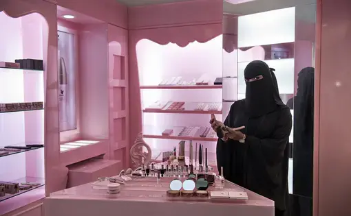 It took a decree from King Abdullah, in 2011, to put tens of thousands of women into the workforce. For the first time, they are interacting daily with men who are not family members, as cashiers in supermarkets and as salesclerks selling abayas and cosmetics and underwear. Image by Kate Brooks. Saudi Arabia, 2013. Media file: zoepf_saudiwomen0005.jpg
