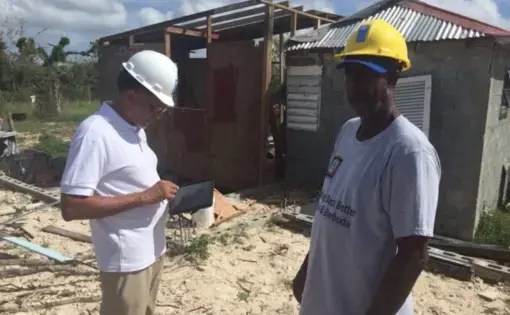 Workers gather data using the Microsoft Building Damage Assessment app in Barbuda. The island was home to 1,600 people, all of whom were evacuated after Hurricane Irma. Image courtesy United Nations Development Program.