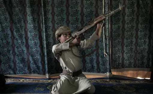 Kahlan, a 12-year-old former child soldier, demonstrates how to use a weapon, at a camp for displaced persons where he took shelter with his family, in Marib, Yemen in this July 27, 2018 photo. Houthi rebels took Kahlan and his classmates, promising to give them new school bags, but instead they were enlisted and trained as fighters tasked with carrying supplies to the front lines. There, he had to elude explosions and airstrikes that left mangled casualties on the battlefield. "The sight of the bodies was…