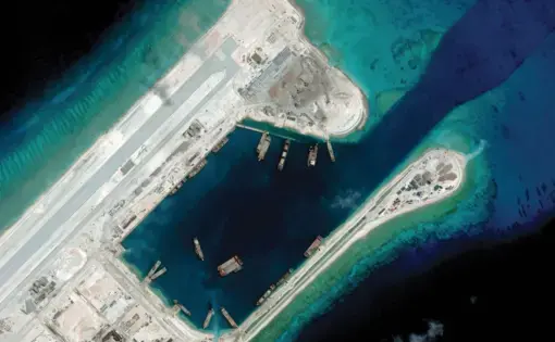 Fiery Cross Reef, an artificial island built by China, boasts a two-mile long runway, massive harbor, and elaborate military fortifications. Image courtesy of CSIS ASIA MARITIME TRANSPARENCY INITIATIVE/DIGITALGLOBE. China, 2018.