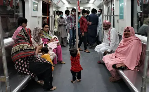 Passengers for the Orange Line in Lahore. Image by Sabrina Toppa. Pakistan, 2020.