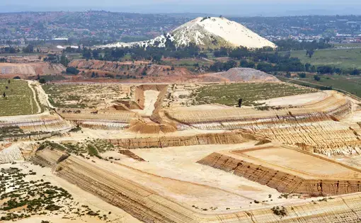 An aerial view of one of Mintails Mining South Africa (Pty) Ltd's mining rights shows extensive, unremediated mine waste. Image by Mark Olalde. South Africa, 2016.