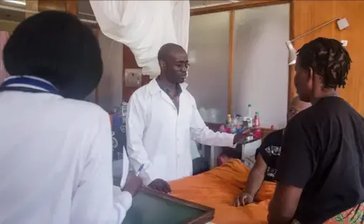 Stanley Zimba examines a patient. Image courtesy of DMS Productions/Dawson Sikute. Zambia, 2019.