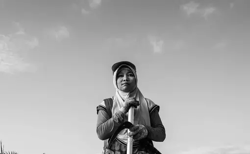 Supraetun at the plantation. Image by Xyza Cruz Bacani. Indonesia, 2018. Supraetun at the plantation. Image by Xyza Cruz Bacani. Indonesia, 2018.