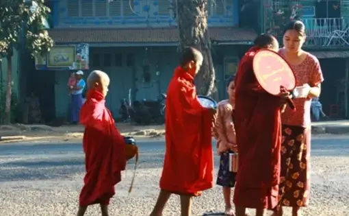Every day at dawn, monks walk the streets on alms round. Townspeople say there are fewer monks than before, as many fled back to their home villages after the government crackdown on September's protests. In deeply religious Burma, monks depend on the ability of the laypeople to provide for them. 1