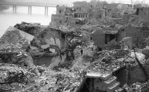 A year and a half after the battle, Mosul’s Old City is still in ruins, and unexploded bombs regularly kill people. Ten million tons of rubble remain. Image by Moises Saman / Magnum for The New Yorker. Iraq, 2018.