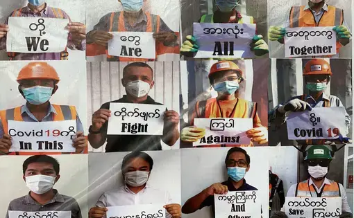 Covid-19 protocols at a construction site in downtown Yangon, Myanmar. Relatively low Covid infection and death rates in Southeast Asia are one of the mysteries of the global pandemic. Photo by Paul Salopek.