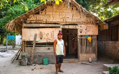 Man photographed in front of his hut in Munduruku territory.