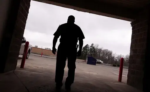 A silhouette shows a man named James, who says the program Achieving Change Through Value-Based Behavior helped him understand how anger and insecurity can lead to domestic violence.