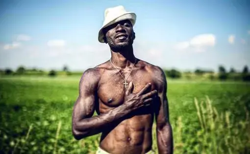 Israel, a 30-year-old Nigerian refugee poses for a portrait in the countryside of Bavaria, Germany. Image by Angelica Ekeke. Germany, 2019.