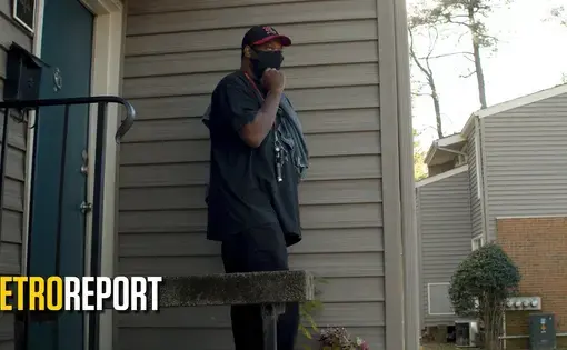 A man exits a house
