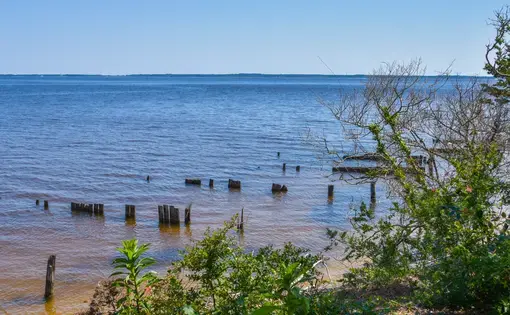 Photo of the ocean in the daytime, taken from a beach.