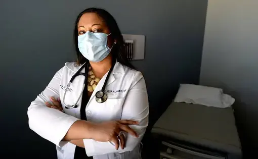 Image of a doctor wearing a medical face mask.