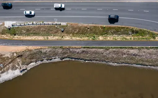 The Dumbarton Bridge near East Palo Alto's shoreline. (JJ Harris - Techboogie/KQED)