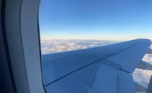 View of a plane wing from a cabin window.